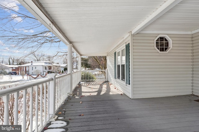 view of snow covered deck