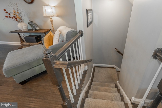 stairs featuring wood-type flooring