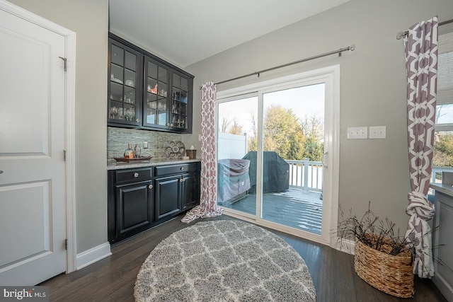 entryway featuring indoor bar and dark hardwood / wood-style flooring