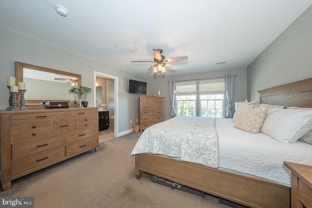 bedroom with ceiling fan, light colored carpet, and lofted ceiling