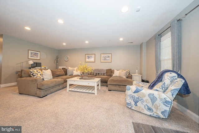 living room with light colored carpet