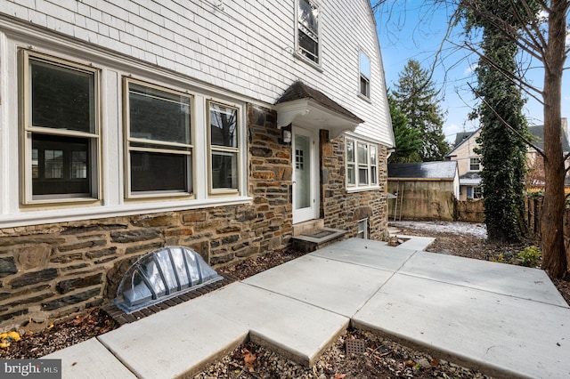 property entrance with a patio