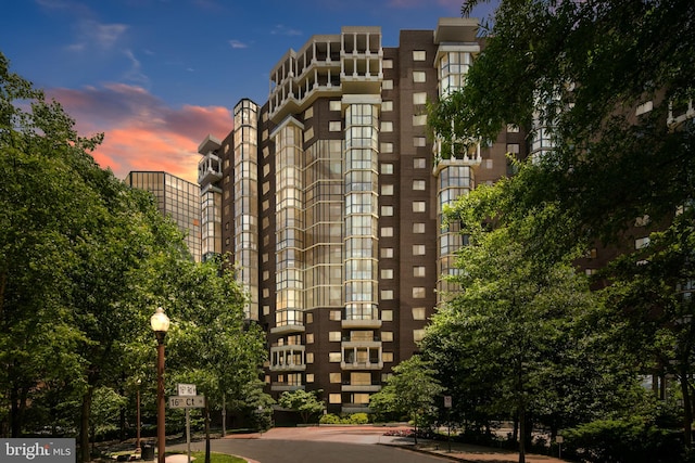 view of outdoor building at dusk