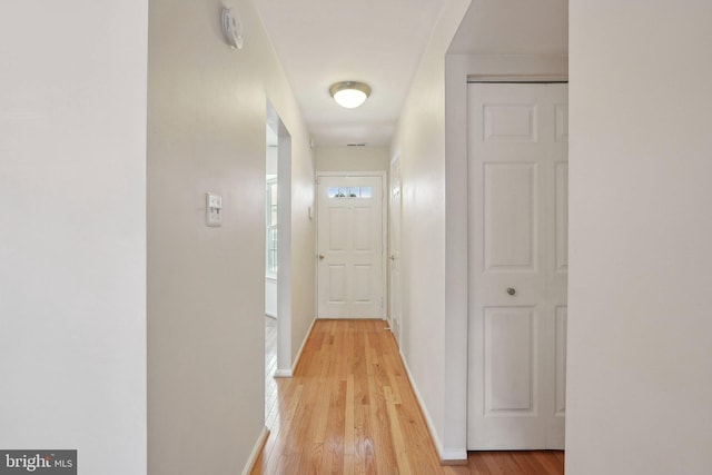 hall with light wood-type flooring