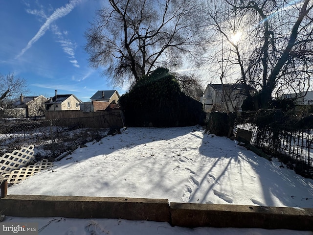 view of yard covered in snow