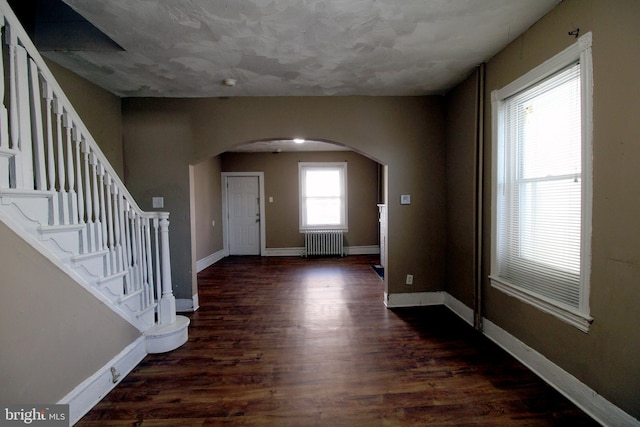 entryway featuring radiator and dark wood-type flooring