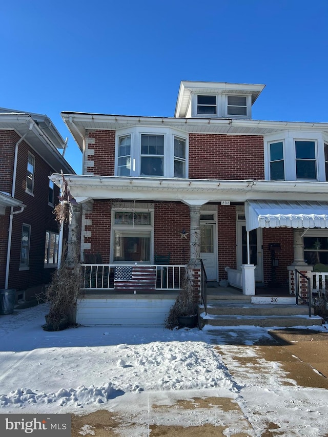 view of property with covered porch