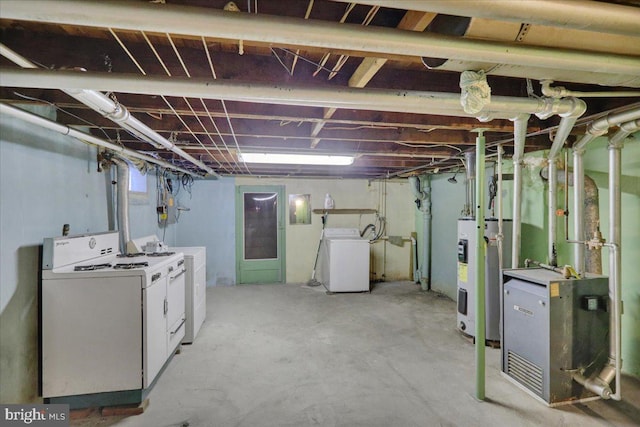 basement featuring separate washer and dryer and electric water heater