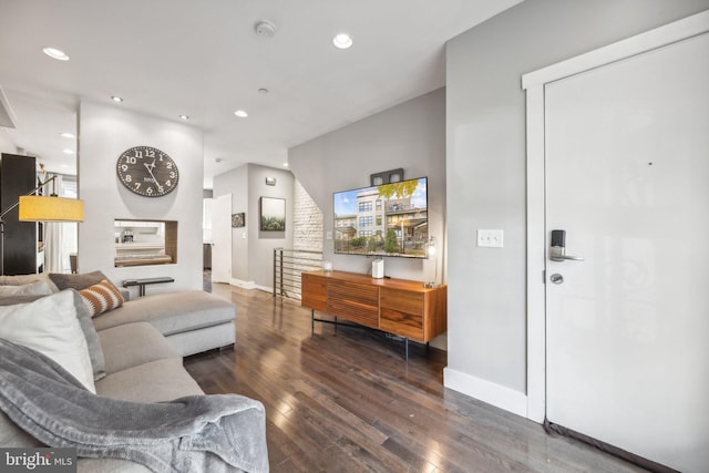 living room with dark hardwood / wood-style flooring