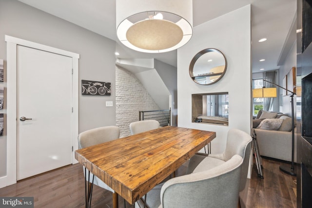 dining space featuring dark hardwood / wood-style flooring