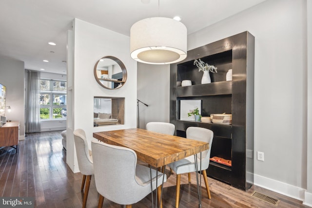 dining space featuring dark hardwood / wood-style floors