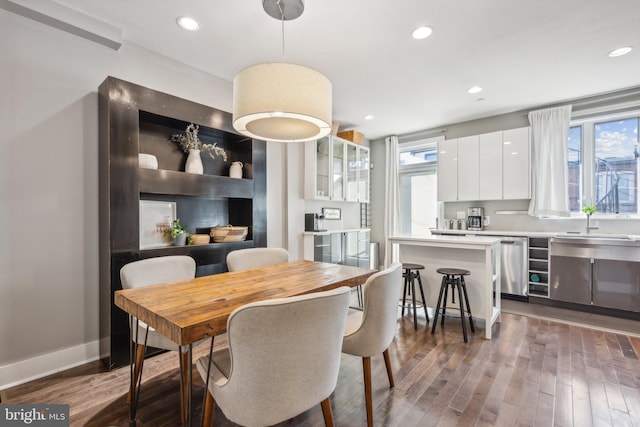 dining room with dark wood-type flooring