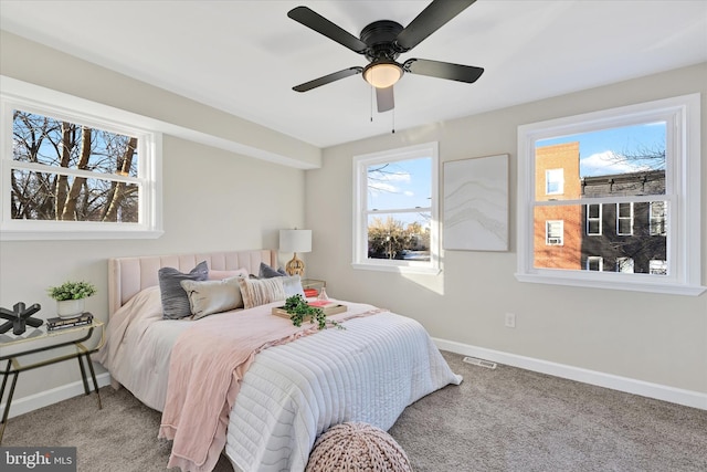 bedroom with ceiling fan and carpet