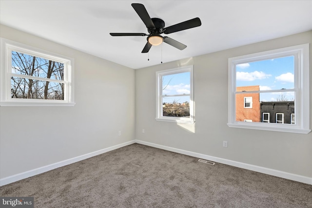 unfurnished room with carpet floors and ceiling fan