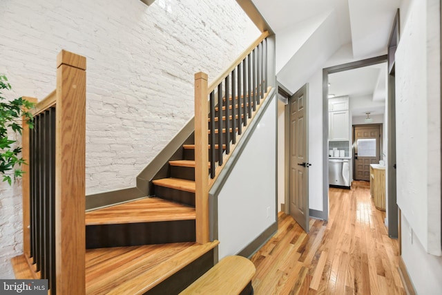 stairs with hardwood / wood-style floors