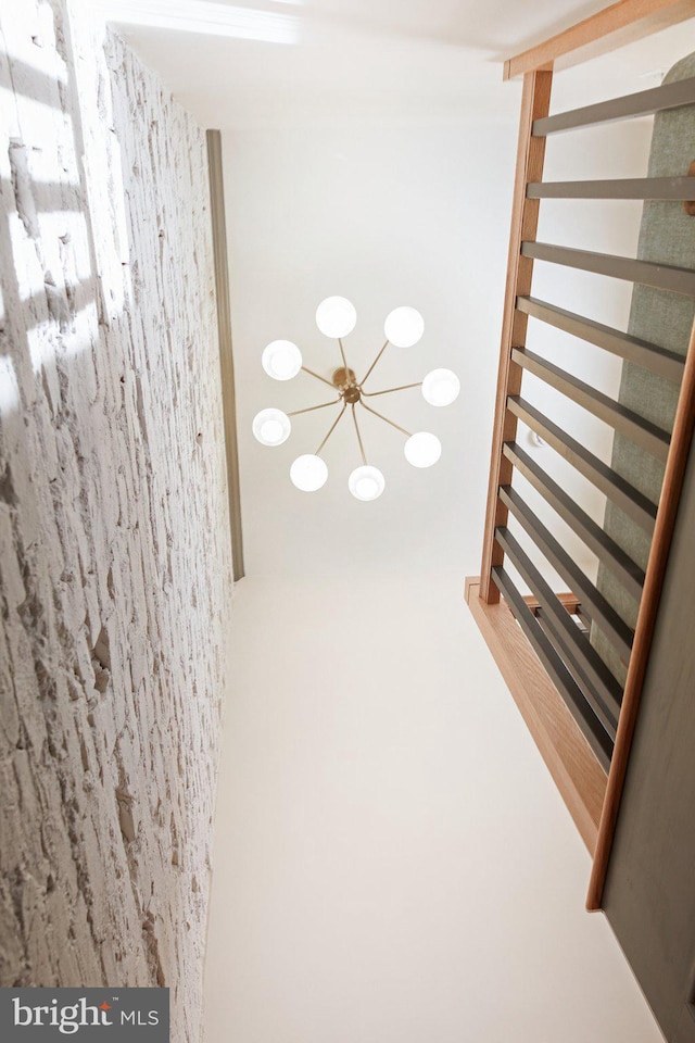 basement with an inviting chandelier