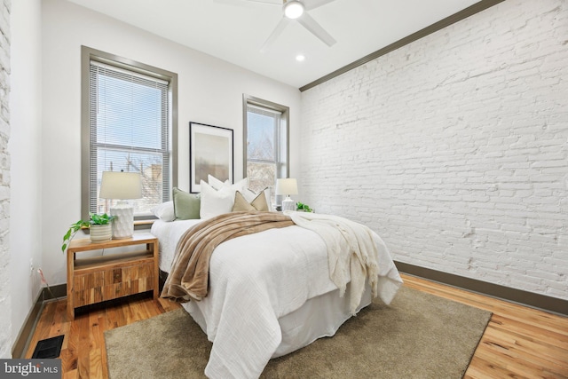 bedroom featuring hardwood / wood-style floors and ceiling fan