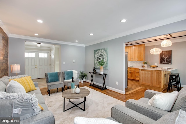 living room featuring light wood-type flooring and crown molding