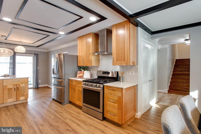 kitchen with stainless steel appliances, wall chimney range hood, tasteful backsplash, crown molding, and light hardwood / wood-style floors