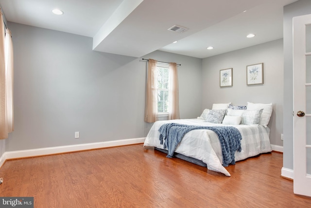 bedroom with wood-type flooring