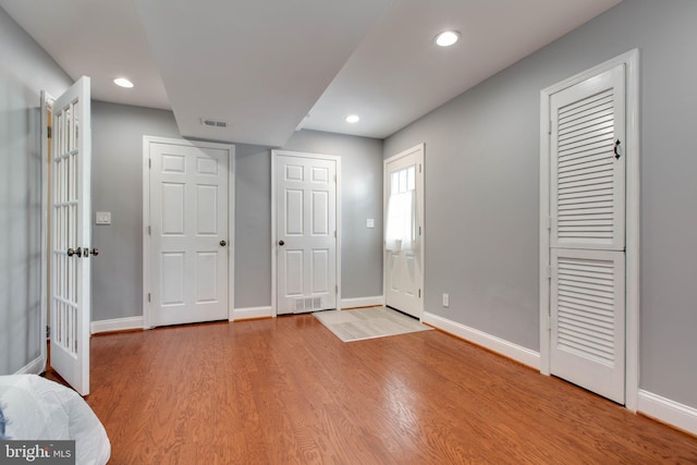 entrance foyer featuring wood-type flooring