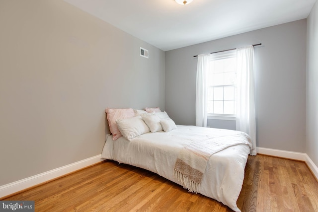 bedroom with light hardwood / wood-style flooring