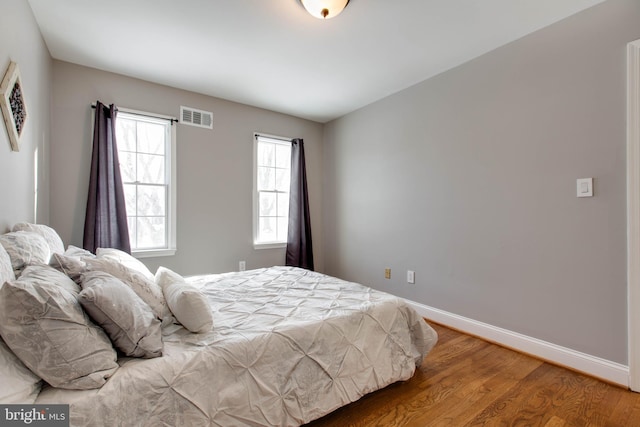 bedroom featuring wood-type flooring