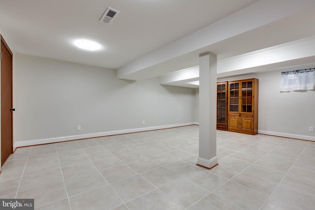 basement with light tile patterned flooring