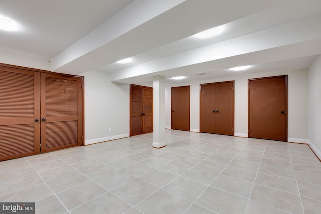 basement featuring light tile patterned floors