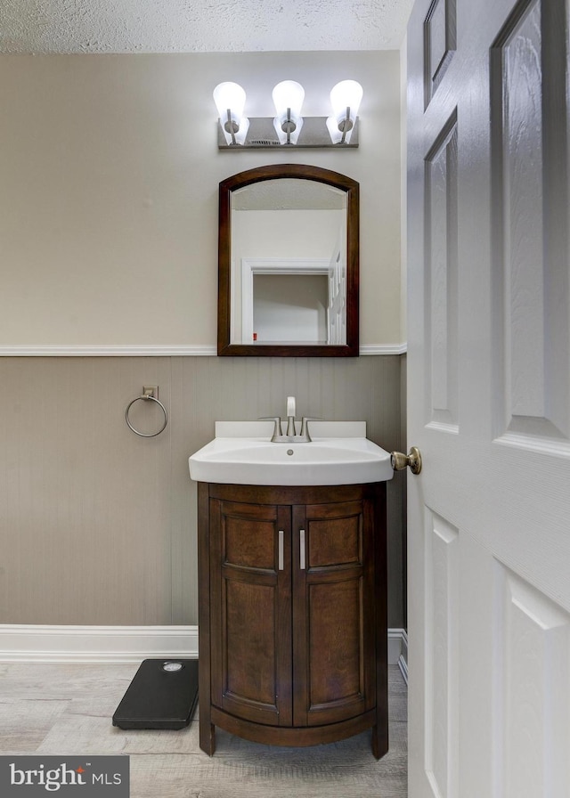 bathroom featuring vanity and a textured ceiling