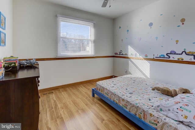 bedroom featuring ceiling fan and light hardwood / wood-style floors