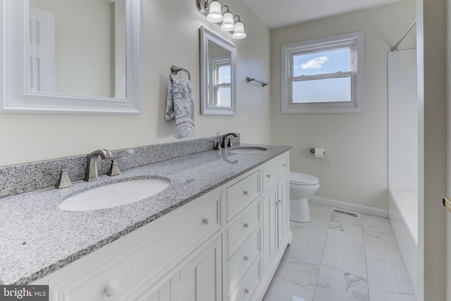 bathroom featuring vanity and toilet