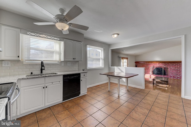 kitchen featuring dishwasher, white cabinets, and sink