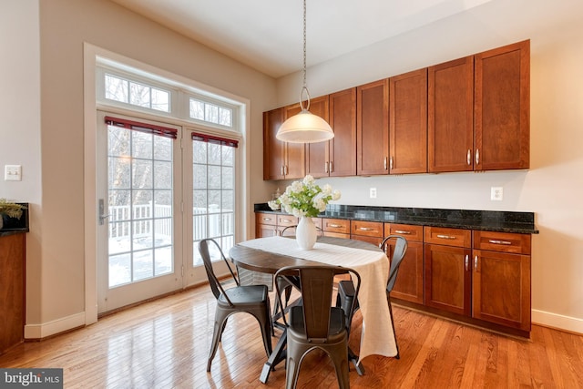 dining space with light hardwood / wood-style floors