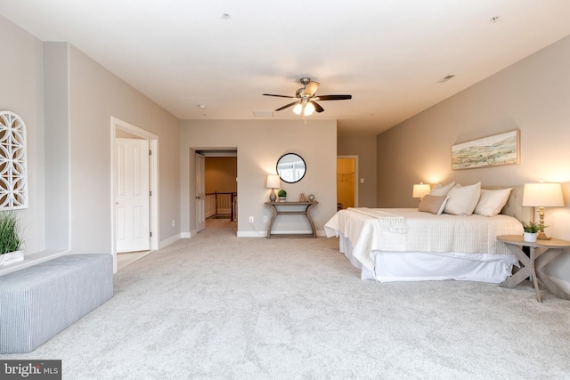 bedroom featuring light carpet and ceiling fan