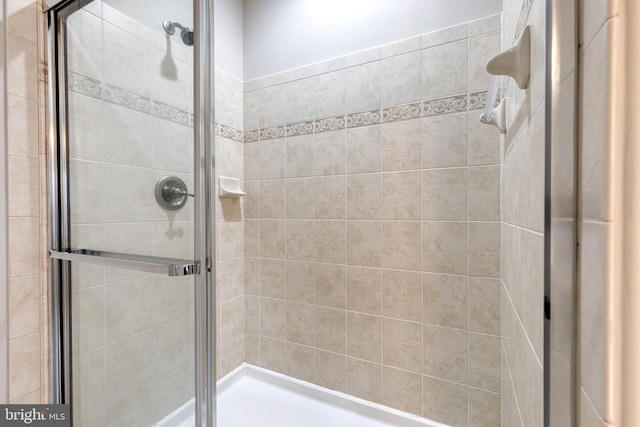 bathroom with a shower with shower door