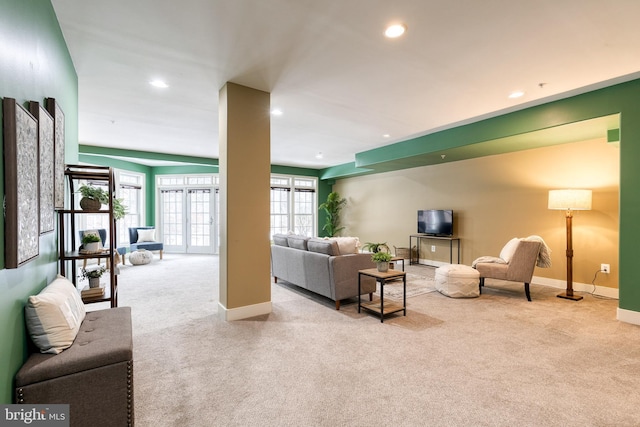 carpeted living room with french doors