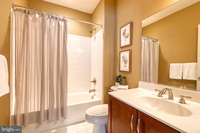 full bathroom featuring toilet, vanity, tile patterned floors, and shower / bath combo