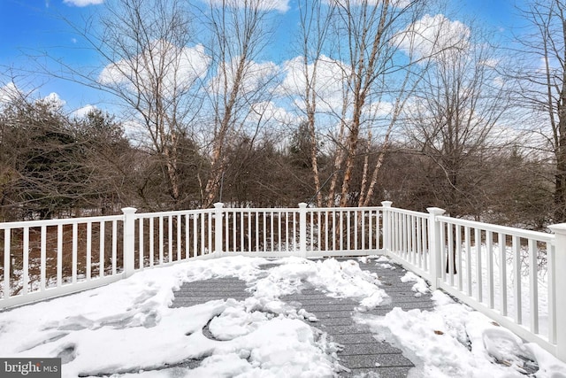 view of snow covered deck