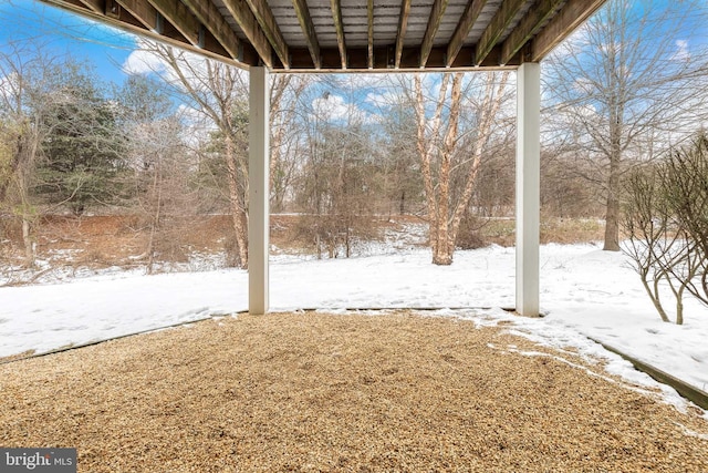 view of yard covered in snow