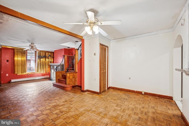 unfurnished living room featuring ceiling fan, light parquet flooring, ornamental molding, and a baseboard heating unit