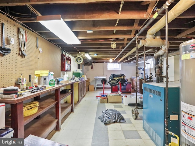 basement featuring a workshop area and gas water heater