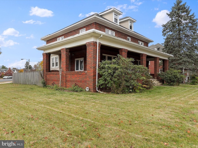 view of side of home featuring a yard