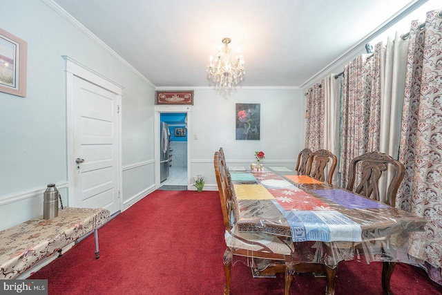 carpeted dining space featuring crown molding and a chandelier