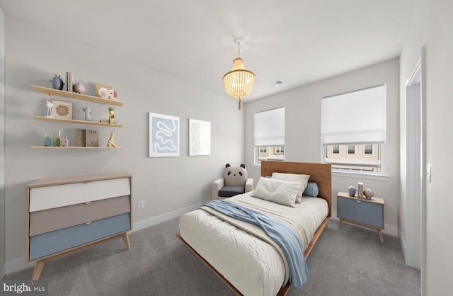 bedroom with a chandelier and carpet flooring