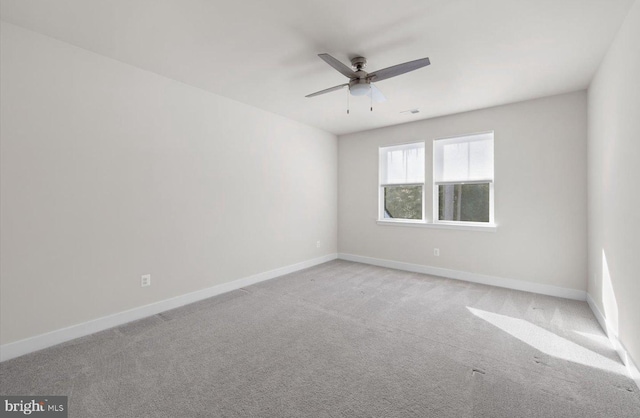 carpeted empty room with ceiling fan