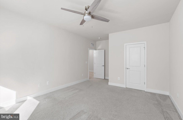 unfurnished bedroom featuring ceiling fan and light colored carpet