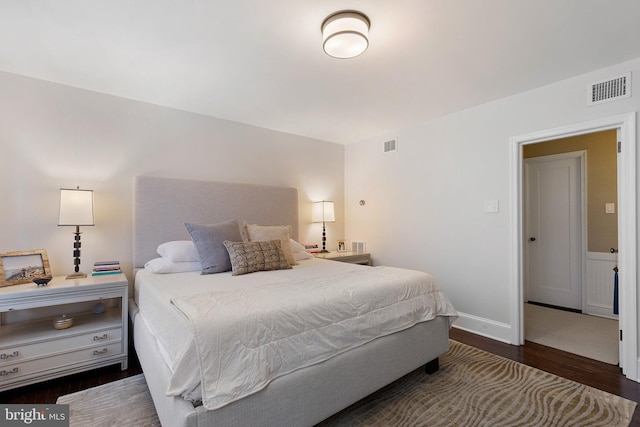 bedroom featuring dark hardwood / wood-style floors