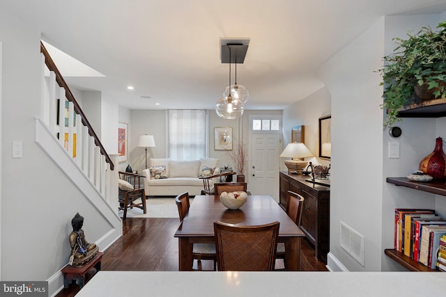 dining area with dark wood-type flooring