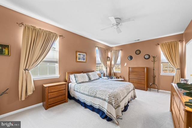 carpeted bedroom with ceiling fan